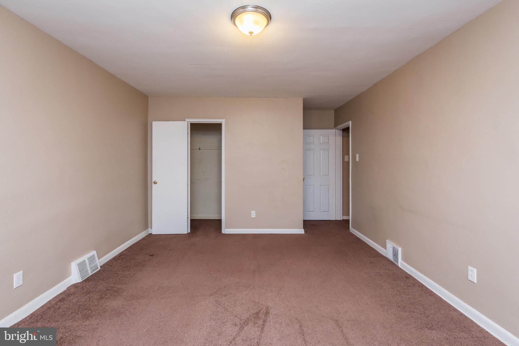 2757 East Country Club Road, Unit 2 Philadelphia, PA 19131 - Photo 19 of 24 a view of an empty room with closet and entryway