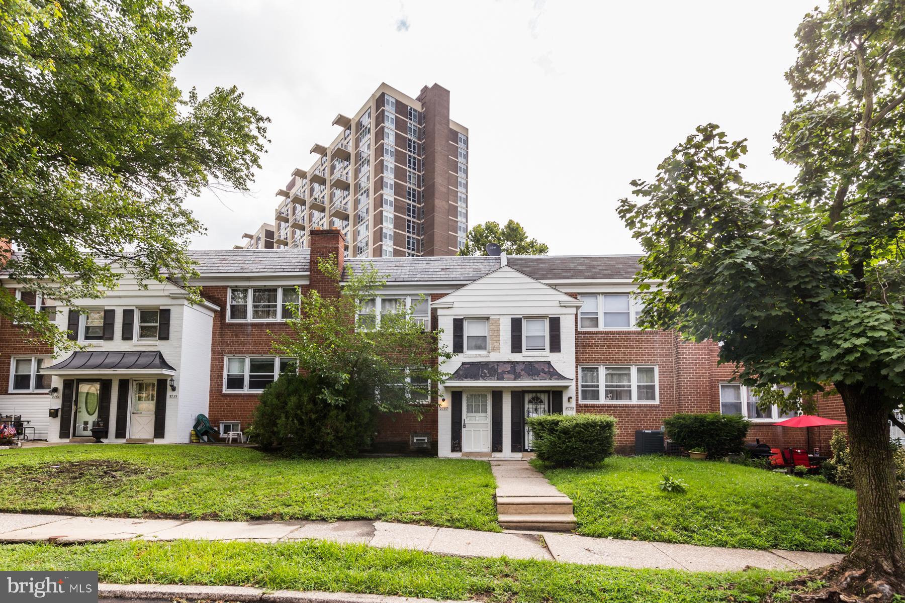 2757 East Country Club Road, Unit 2 Philadelphia, PA 19131 - Photo 23 of 24 a view of a big house with a big yard and large trees