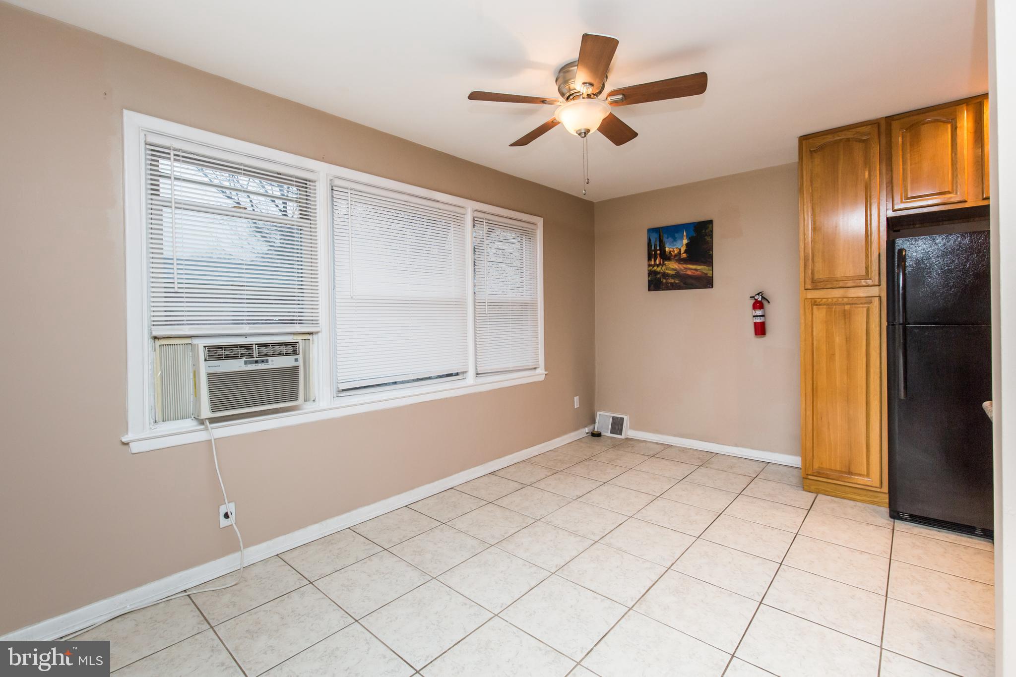 2757 East Country Club Road, Unit 2 Philadelphia, PA 19131 - Photo 6 of 24 an empty room with closet and windows
