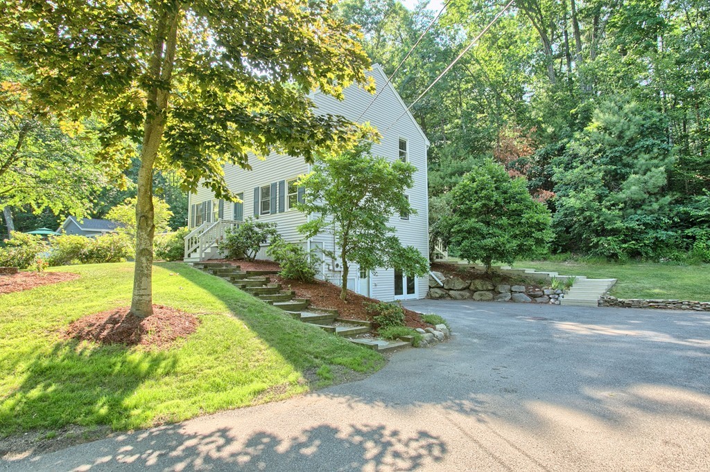 13 Valley Road Groton, MA 01450 - Photo 1 of 30 a view of a yard in front of house