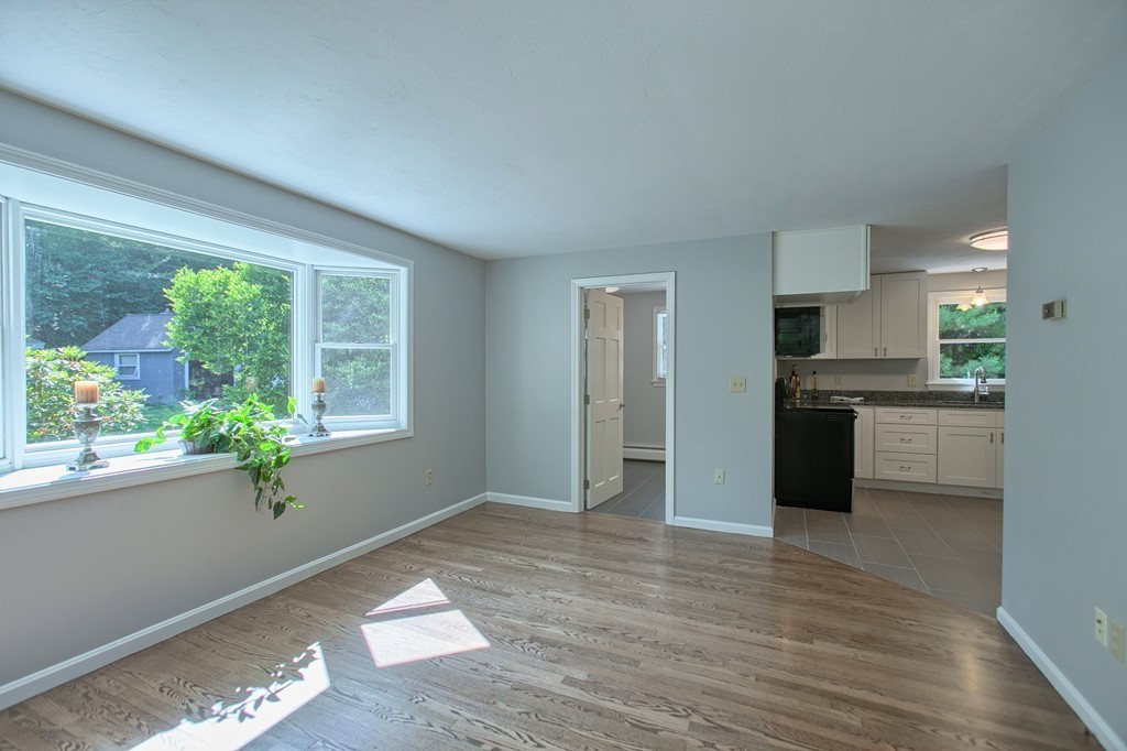 13 Valley Road Groton, MA 01450 - Photo 11 of 30 a view of kitchen with wooden floor and electronic appliances