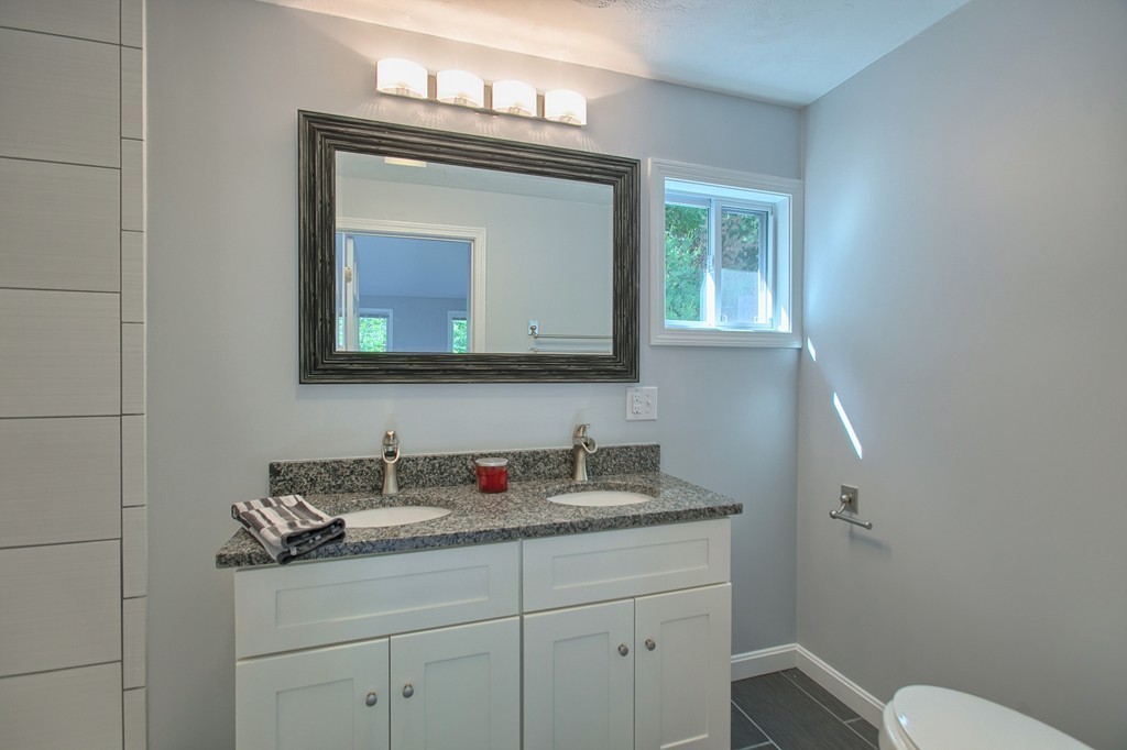13 Valley Road Groton, MA 01450 - Photo 15 of 30 a bathroom with a toilet sink and mirror