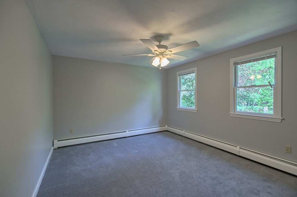 13 Valley Road Groton, MA 01450 - Photo 17 of 30 an empty room with windows and fan