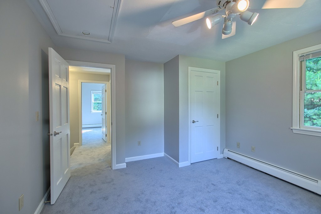 13 Valley Road Groton, MA 01450 - Photo 18 of 30 a view of an empty room with a chandelier fan