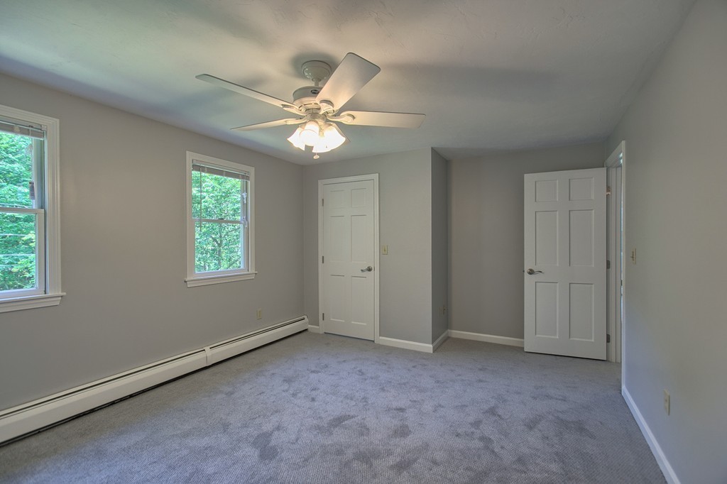 13 Valley Road Groton, MA 01450 - Photo 19 of 30 an empty room with windows and fan