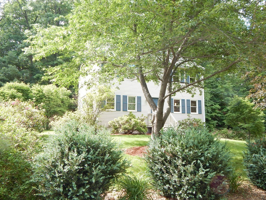 13 Valley Road Groton, MA 01450 - Photo 25 of 30 a front view of a house with garden