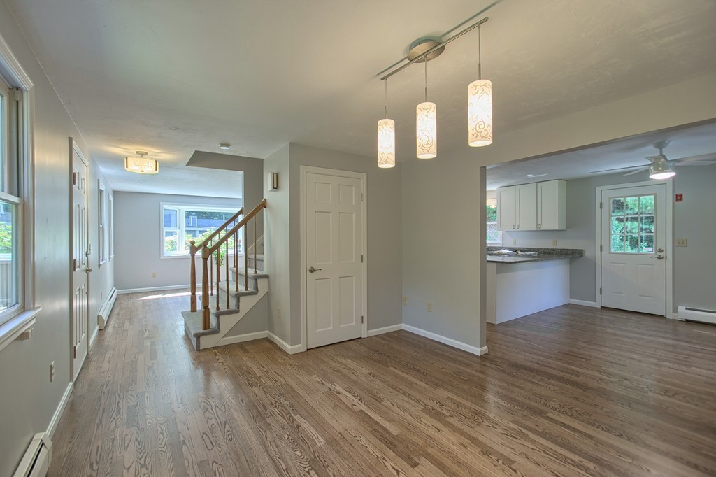 13 Valley Road Groton, MA 01450 - Photo 10 of 30 a view of a kitchen with wooden floor and a kitchen
