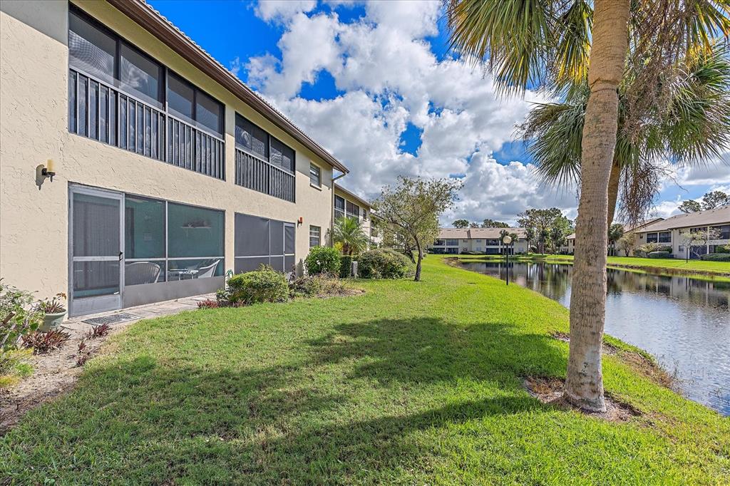 320 Mission Trail North, Unit B Venice, FL 34285 - Photo 2 of 25 a view of a house with a yard