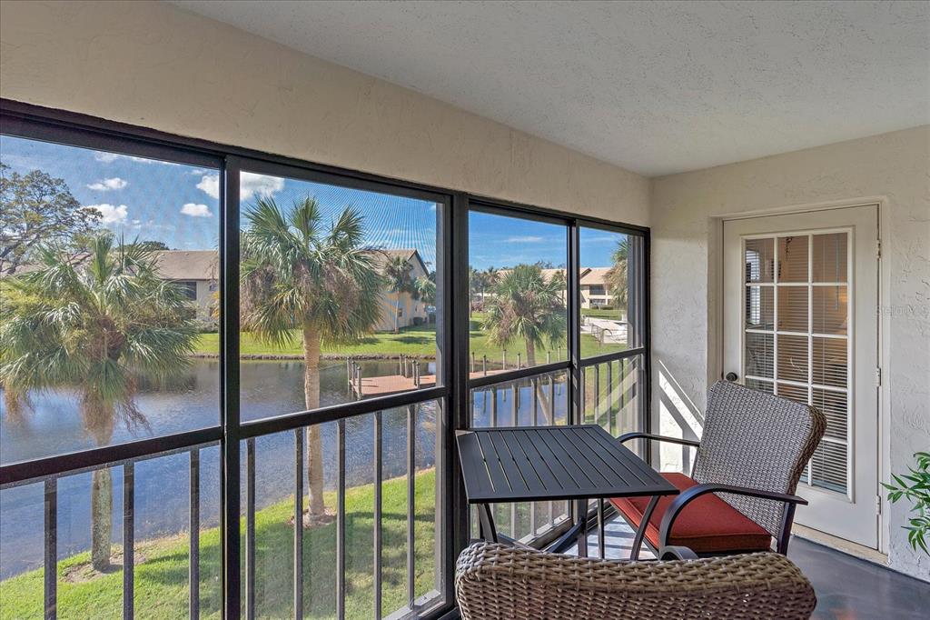 320 Mission Trail North, Unit B Venice, FL 34285 - Photo 22 of 25 a view of a city from a balcony with furniture