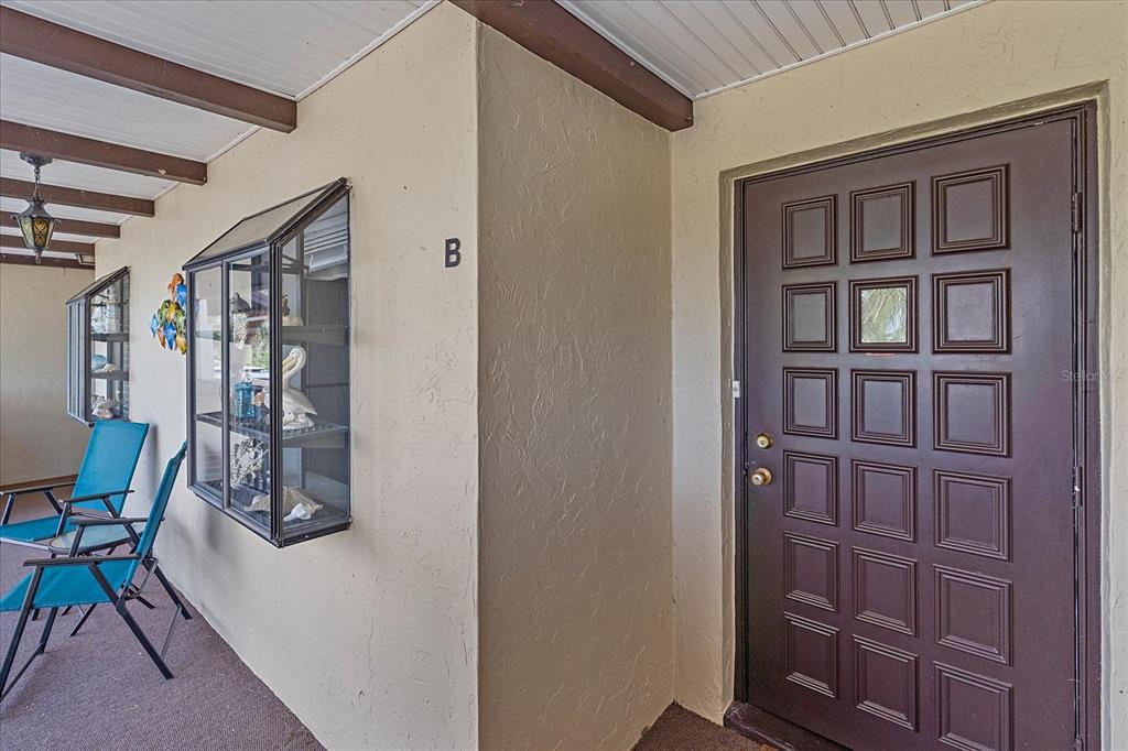 320 Mission Trail North, Unit B Venice, FL 34285 - Photo 25 of 25 a hallway with chairs and closet