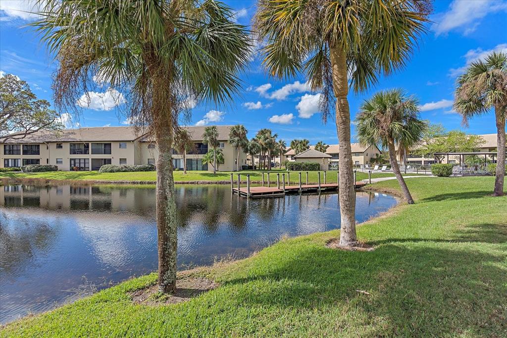 320 Mission Trail North, Unit B Venice, FL 34285 - Photo 3 of 25 a view of a lake with a house