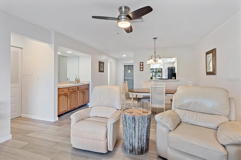 320 Mission Trail North, Unit B Venice, FL 34285 - Photo 6 of 25 a living room with furniture and kitchen view
