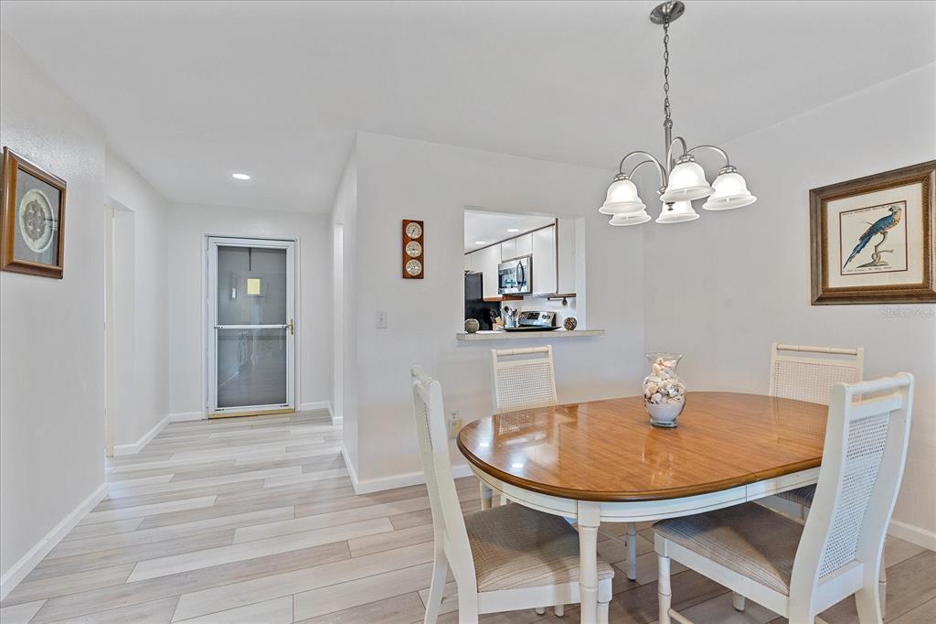 320 Mission Trail North, Unit B Venice, FL 34285 - Photo 8 of 25 a dining room with furniture and window