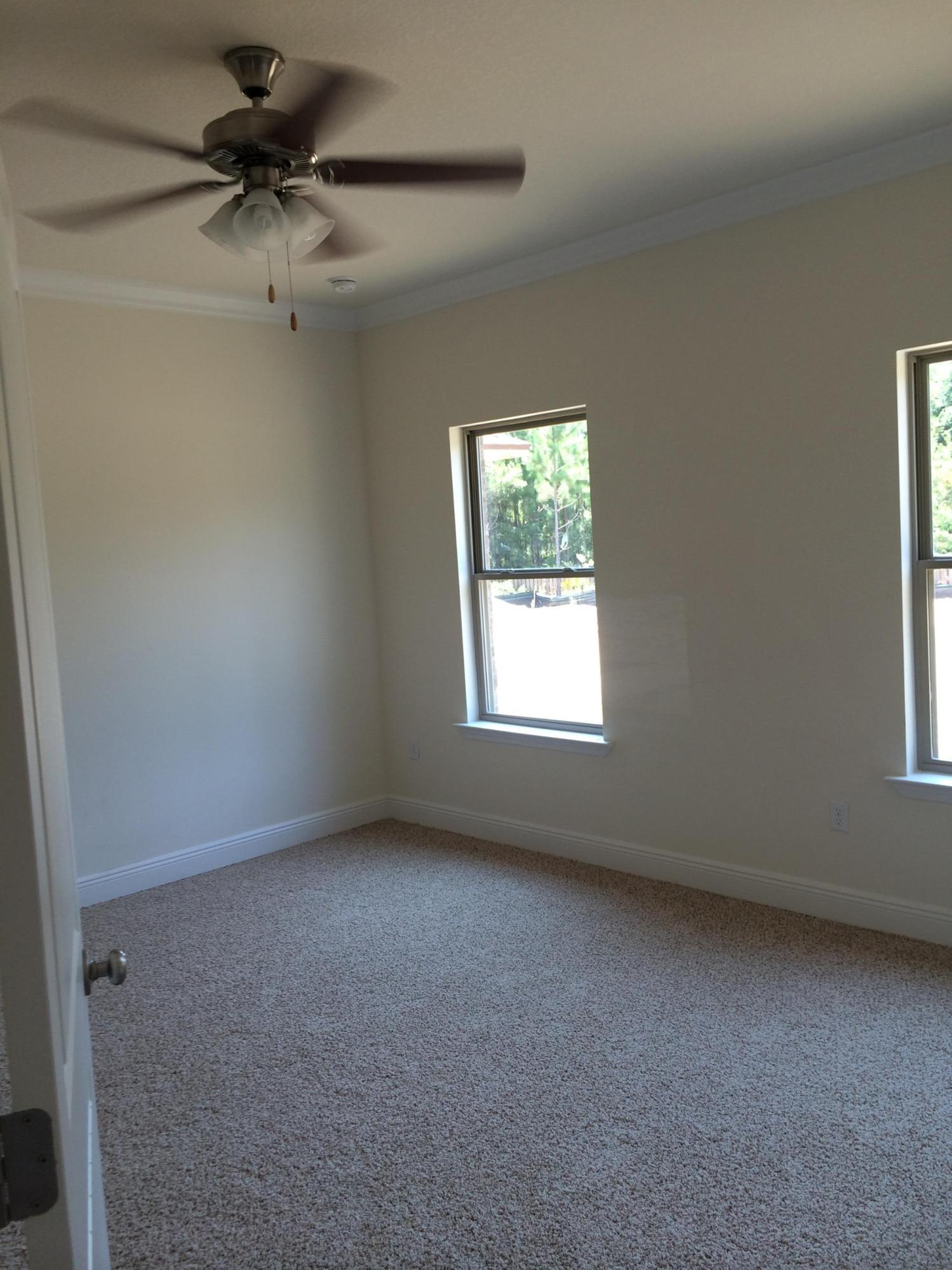 124 Pin Oak Loop Santa Rosa Beach, FL 32459 - Photo 7 of 19 an empty room with a window