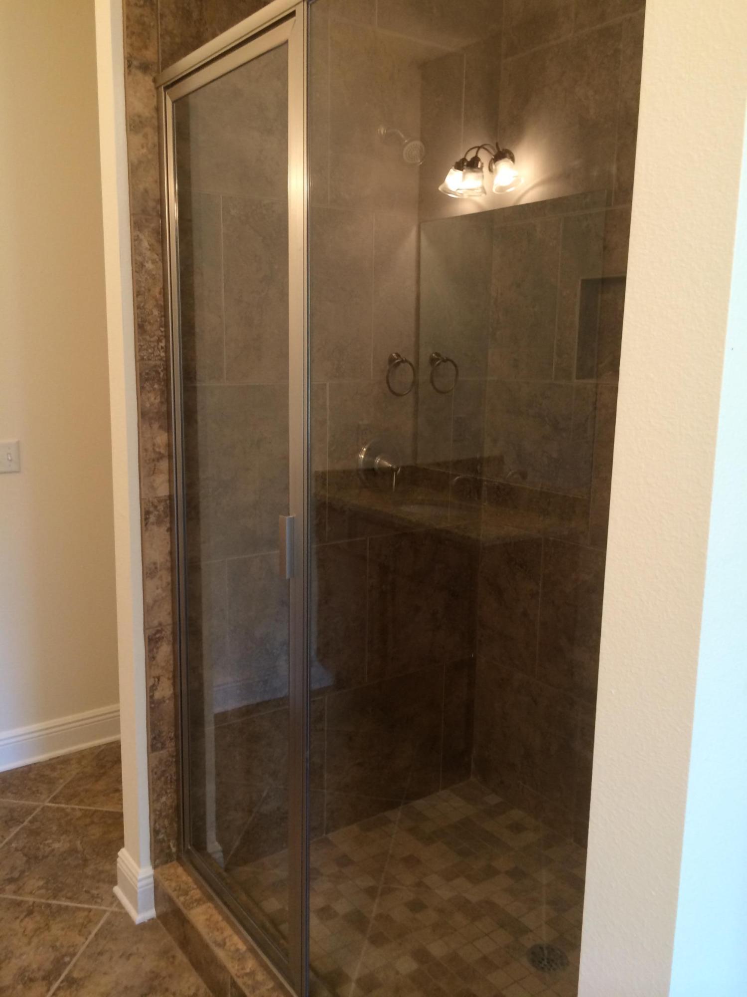 124 Pin Oak Loop Santa Rosa Beach, FL 32459 - Photo 10 of 19 a bathroom with a glass shower door