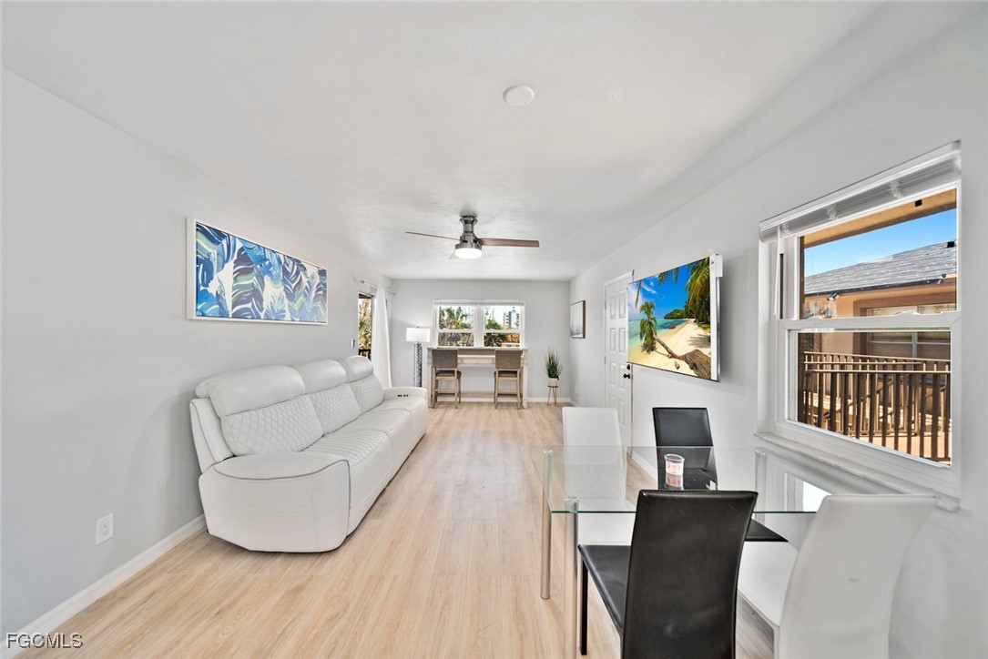 16881 Davis Road, Unit 721 Fort Myers, FL 33908 - Photo 3 of 23 a living room with furniture and a flat screen tv