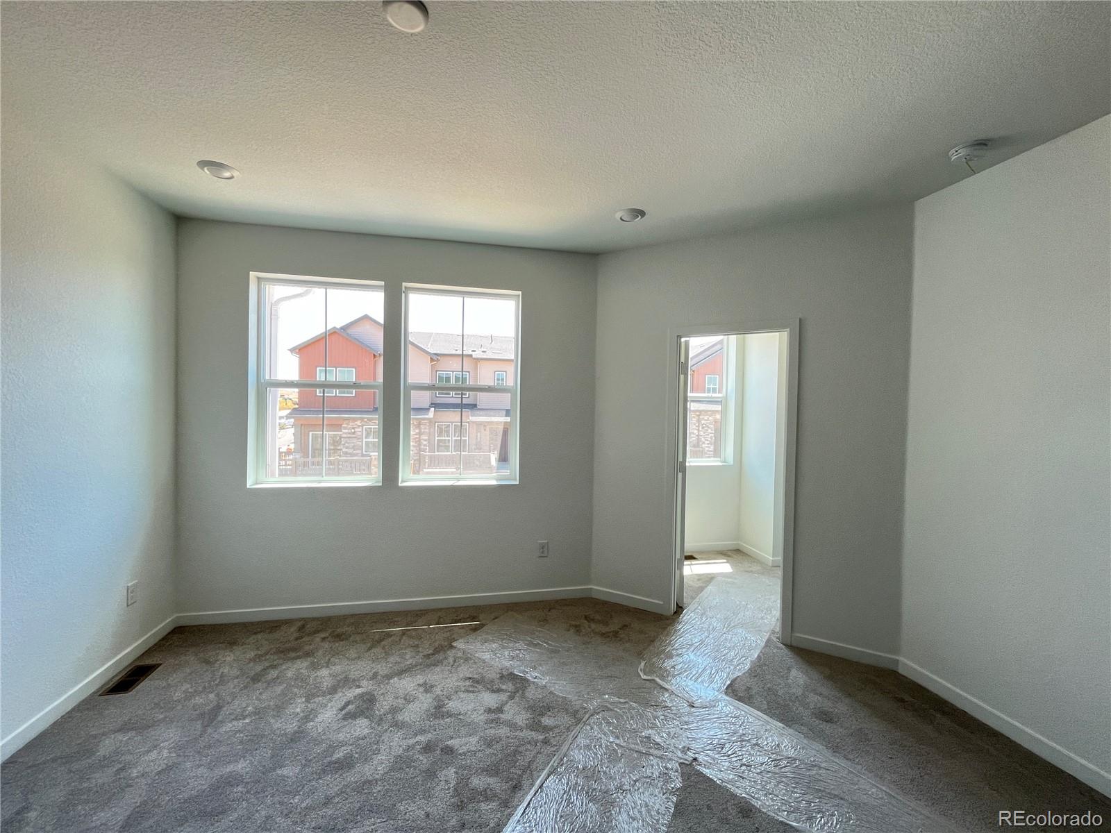1987 South Gold Bug Way Aurora, CO 80018 - Photo 5 of 18 an empty room with windows