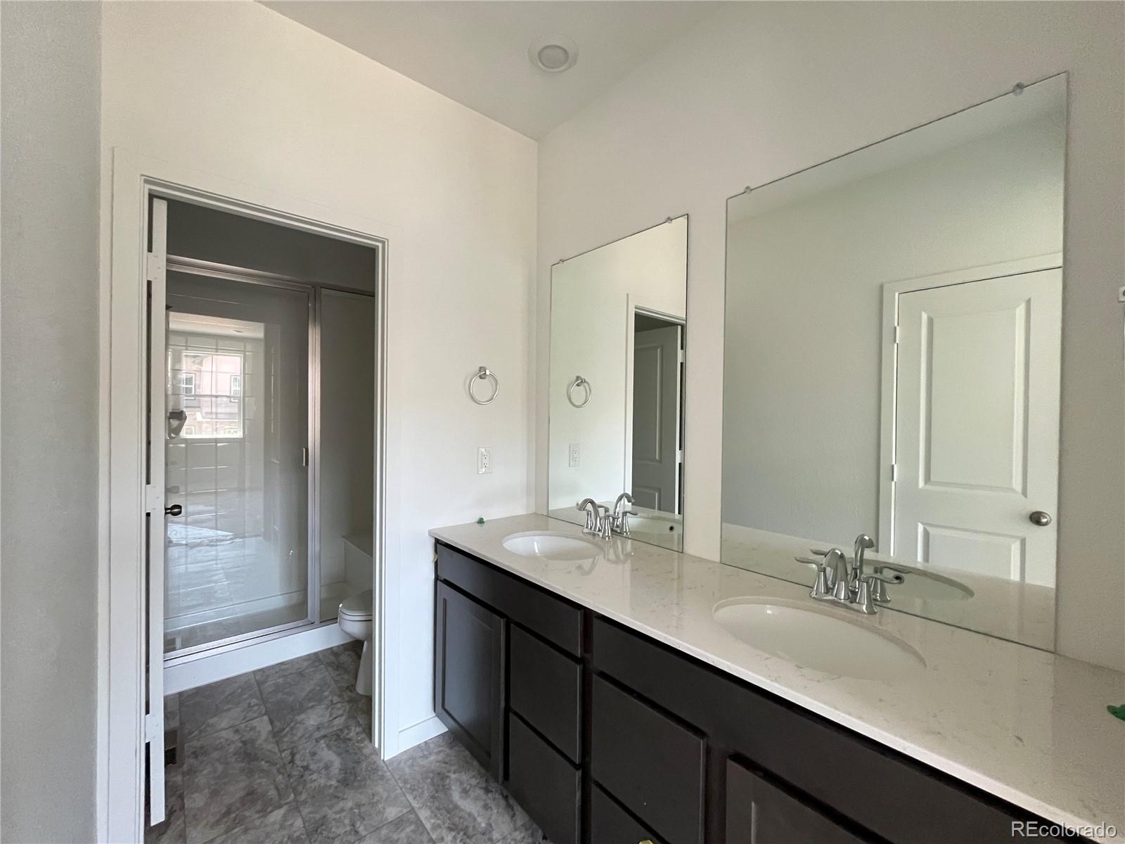 1987 South Gold Bug Way Aurora, CO 80018 - Photo 6 of 18 a bathroom with a sink and a mirror