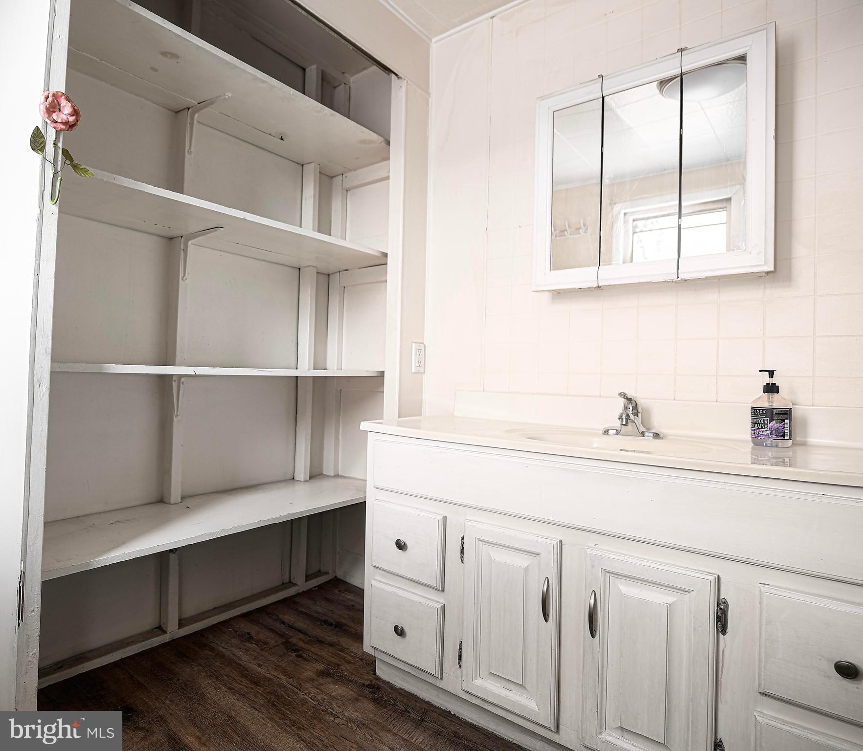 807 Wise Avenue Dundalk, MD 21222 - Photo 11 of 42 Linen closet in primary bathroom