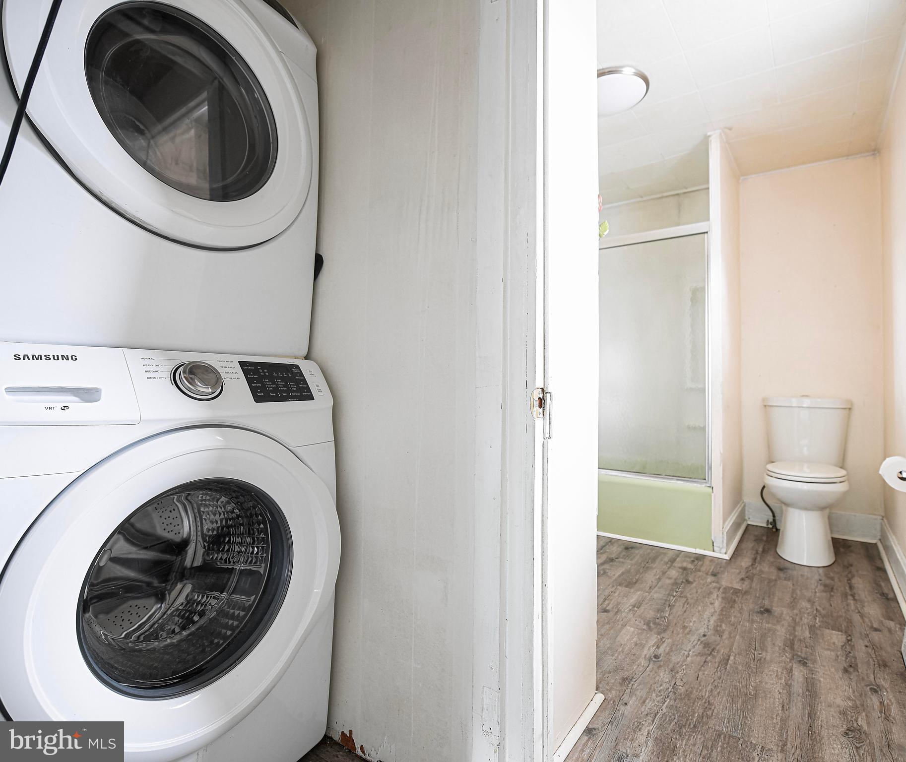 807 Wise Avenue Dundalk, MD 21222 - Photo 13 of 42 Washer and dryer sit off of the primary bathroom