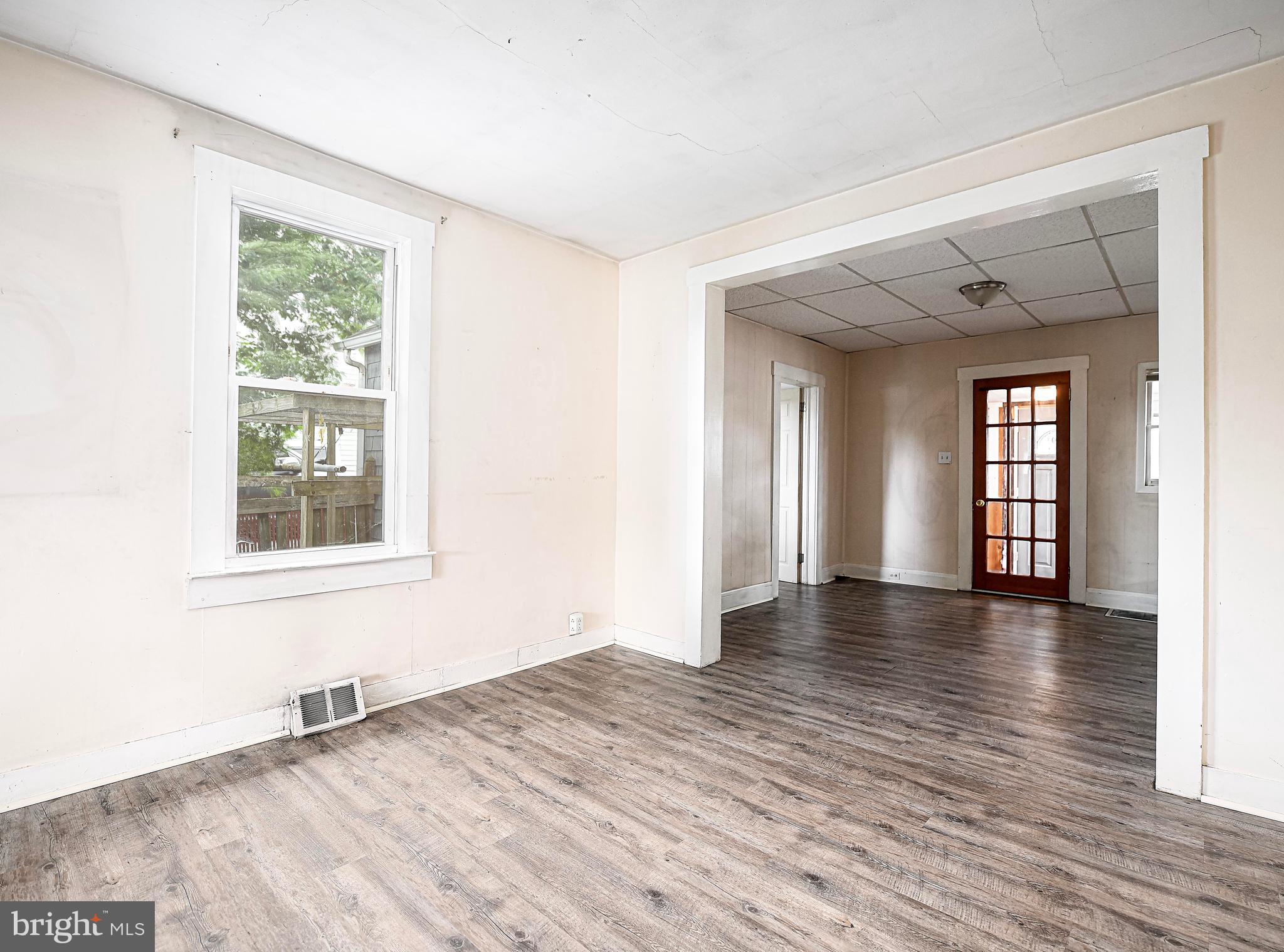 807 Wise Avenue Dundalk, MD 21222 - Photo 14 of 42 Living room open to sunroom