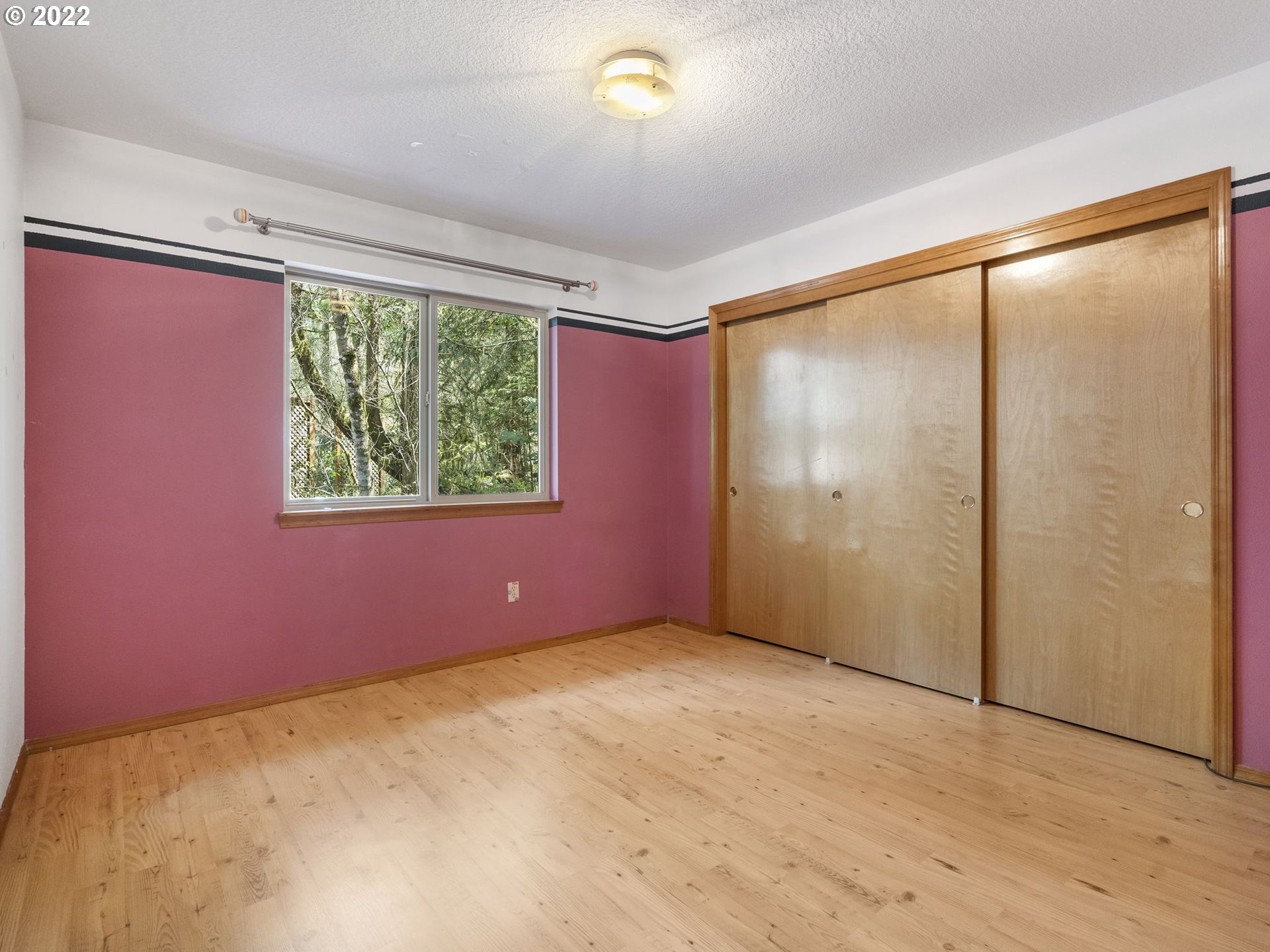 21676 East Lodge Lane Rhododendron, OR 97049 - Photo 17 of 32 an empty room with windows and closet