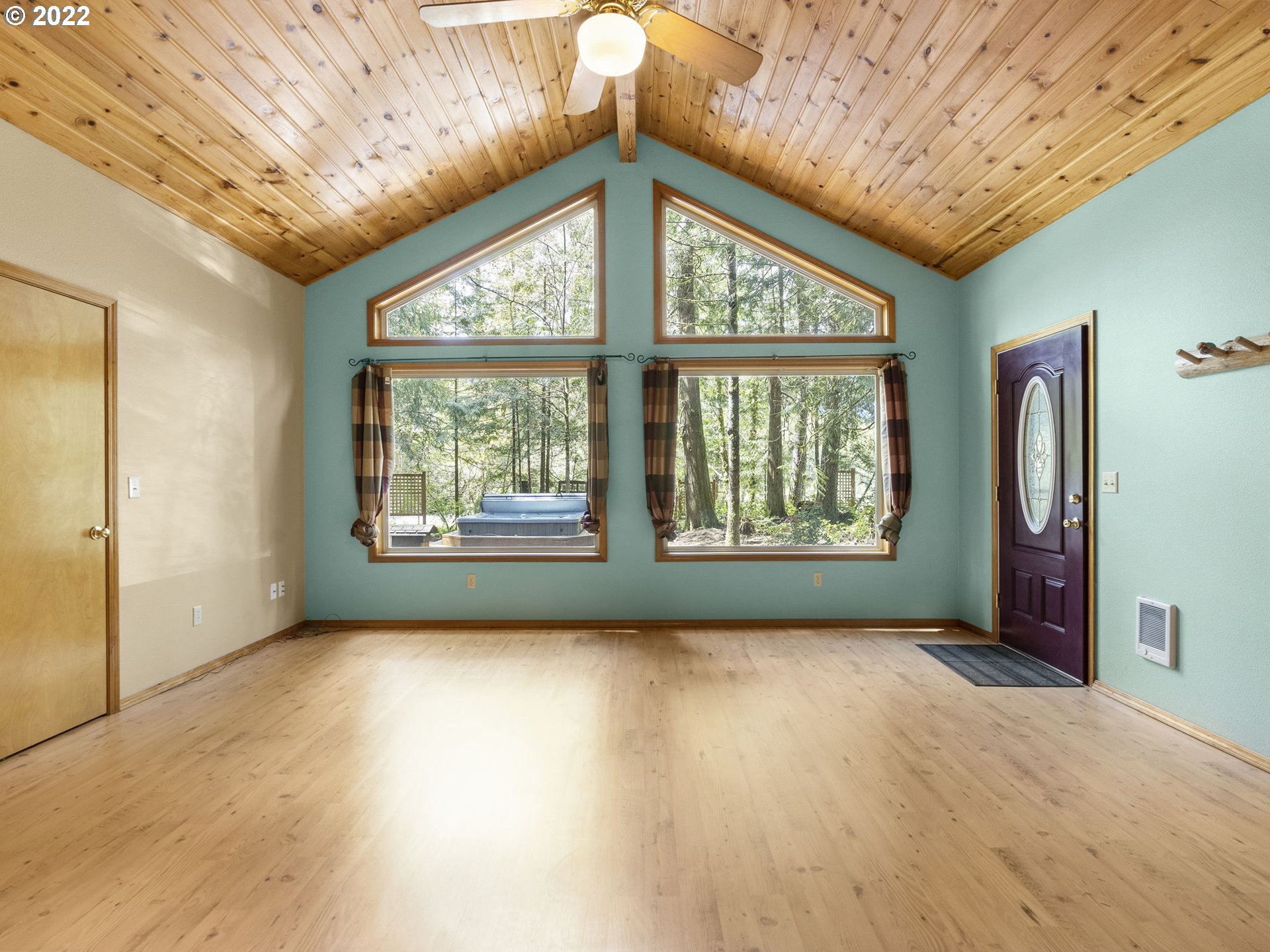 21676 East Lodge Lane Rhododendron, OR 97049 - Photo 4 of 32 a view of hallway with a large window and chandelier