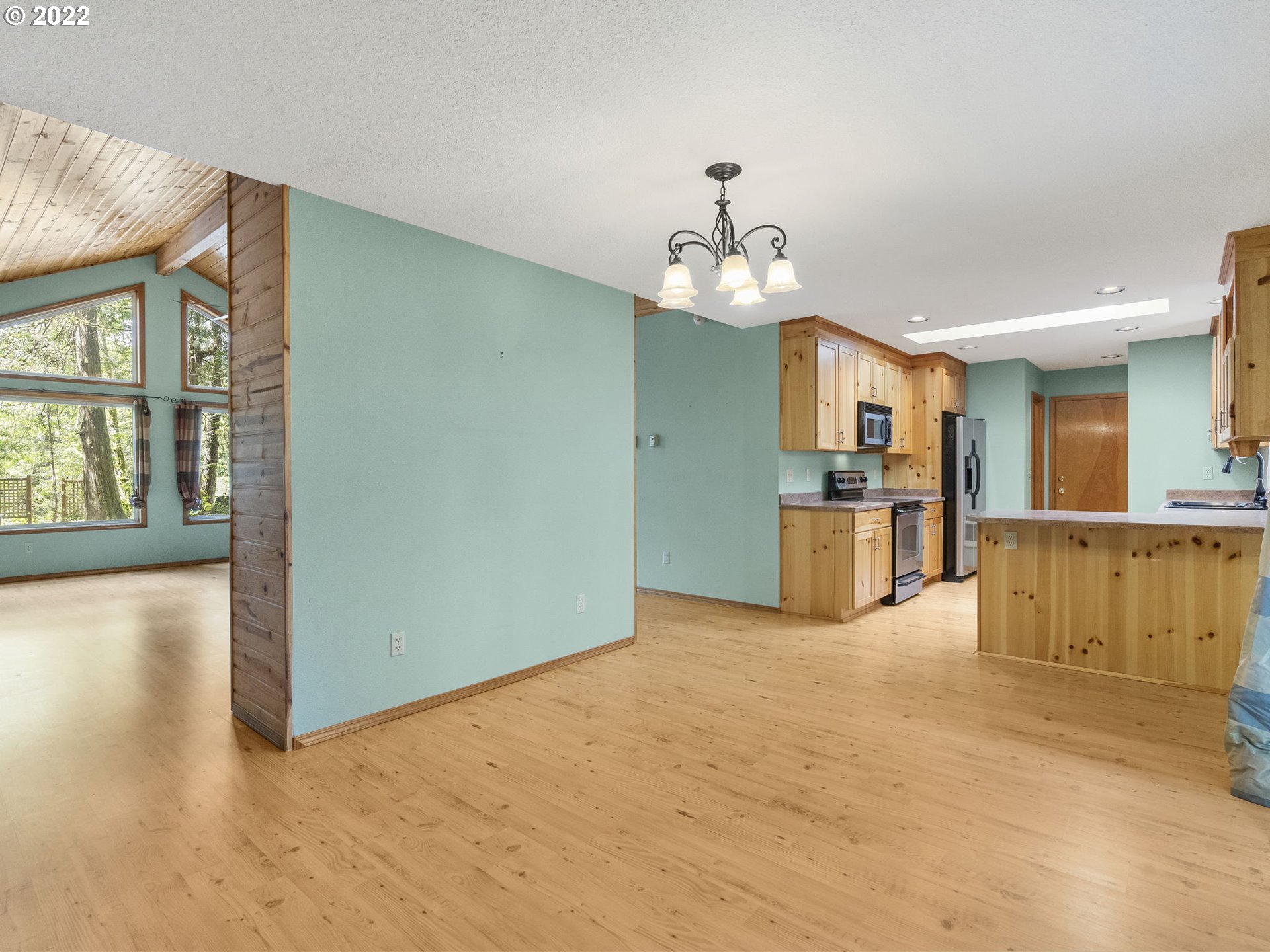 21676 East Lodge Lane Rhododendron, OR 97049 - Photo 10 of 32 a view of a kitchen with furniture and wooden floor