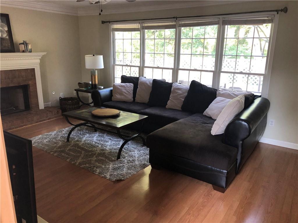 490 Sherman Oaks Way Alpharetta, GA 30004 - Photo 2 of 21 a living room with furniture and a fireplace