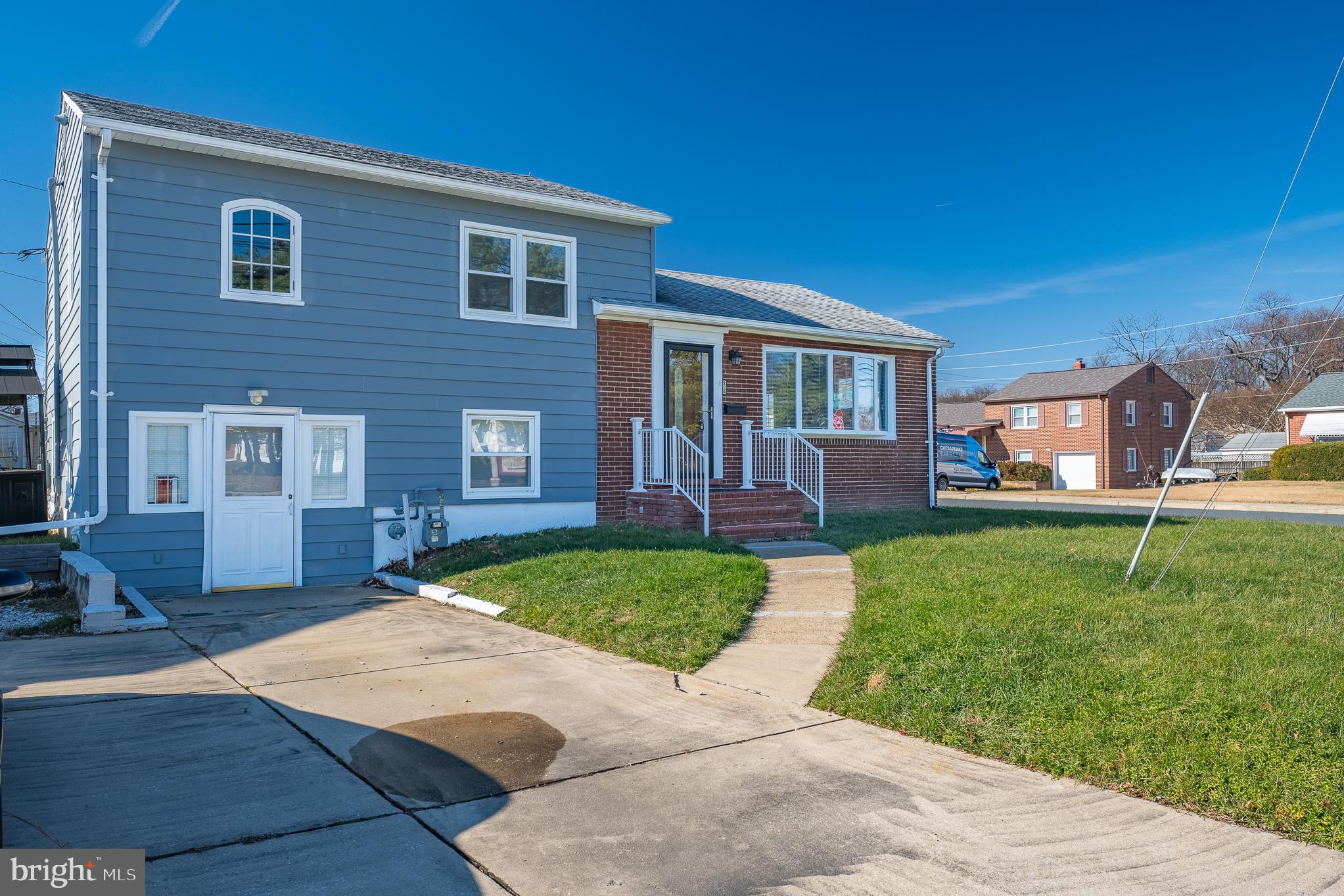312 North Hammonds Ferry Road Linthicum Heights, MD 21090 - Photo 1 of 56 a front view of a house with a yard and trees