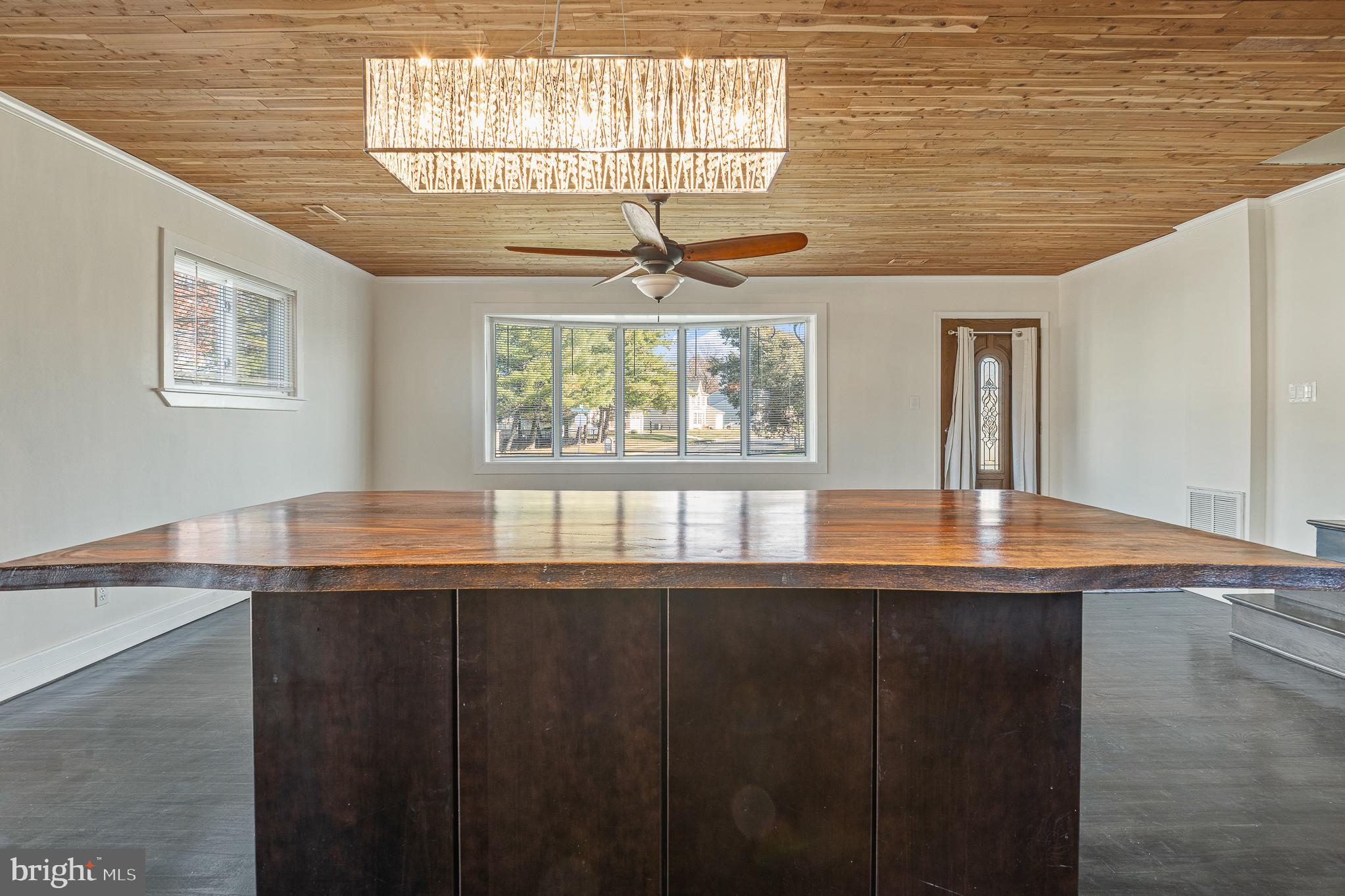 312 North Hammonds Ferry Road Linthicum Heights, MD 21090 - Photo 20 of 56 a dining room with wooden floor and a chandelier