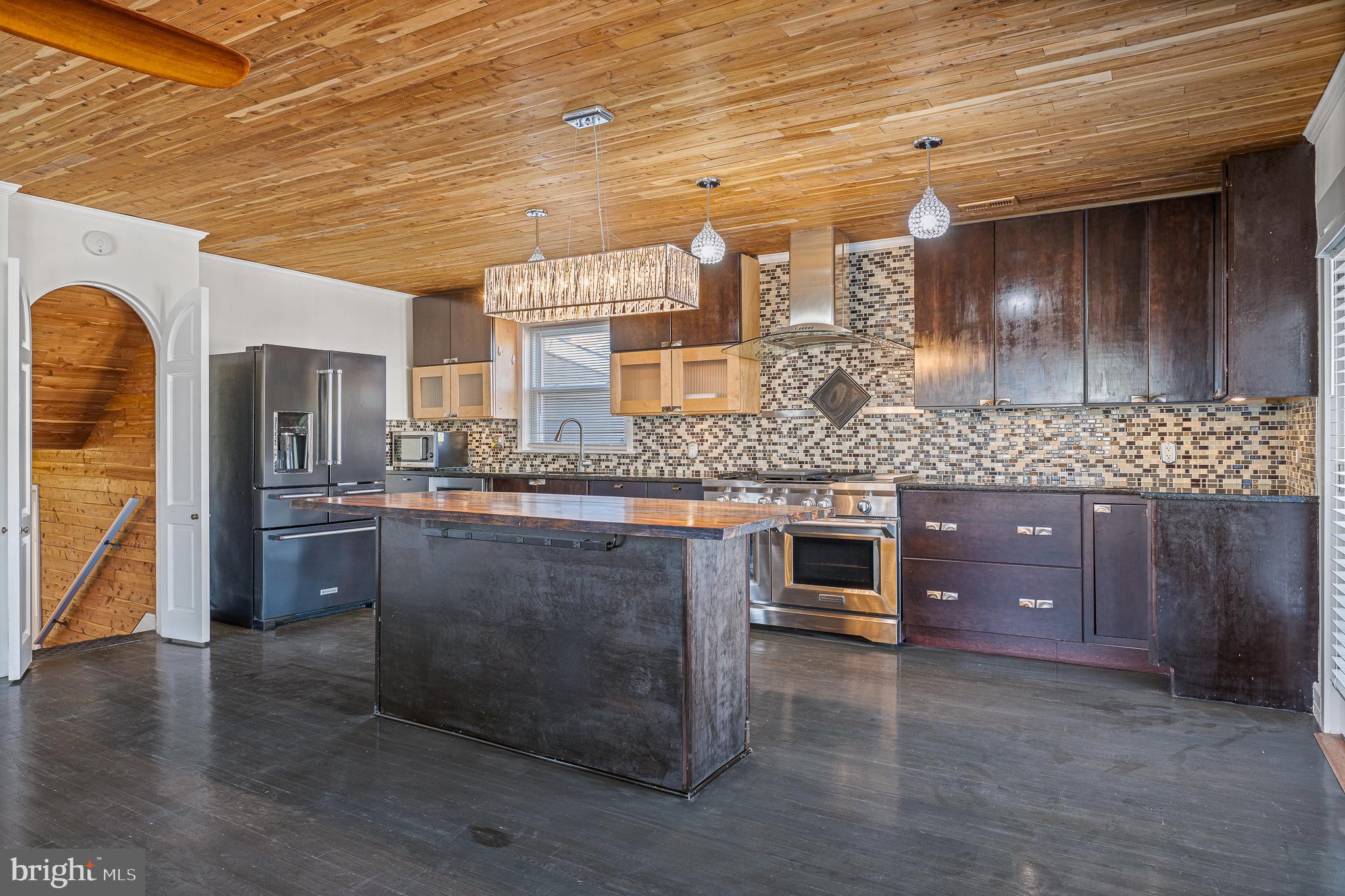 312 North Hammonds Ferry Road Linthicum Heights, MD 21090 - Photo 21 of 56 a kitchen with stainless steel appliances granite countertop a stove a sink and a refrigerator