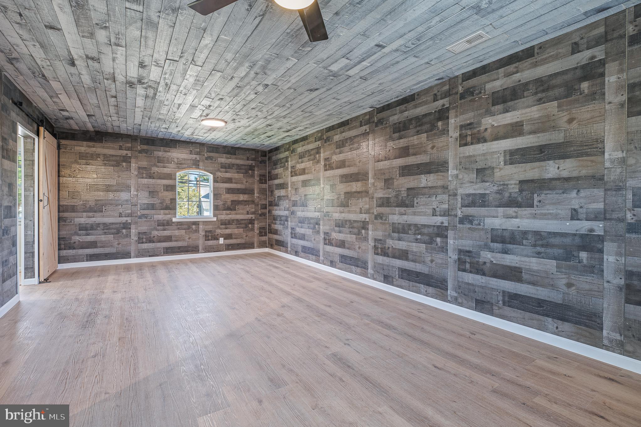 312 North Hammonds Ferry Road Linthicum Heights, MD 21090 - Photo 24 of 56 a view of an empty room and wooden floor