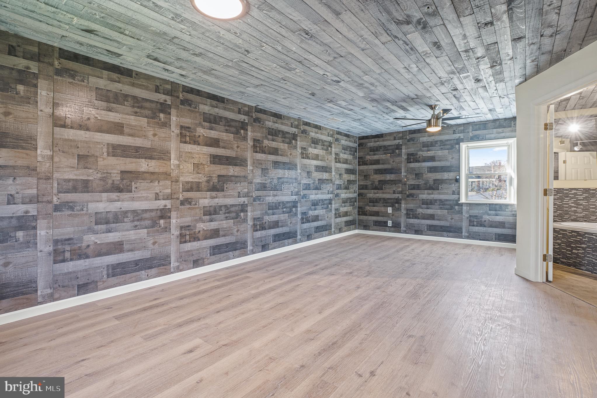 312 North Hammonds Ferry Road Linthicum Heights, MD 21090 - Photo 26 of 56 a view of an empty room with wooden floor