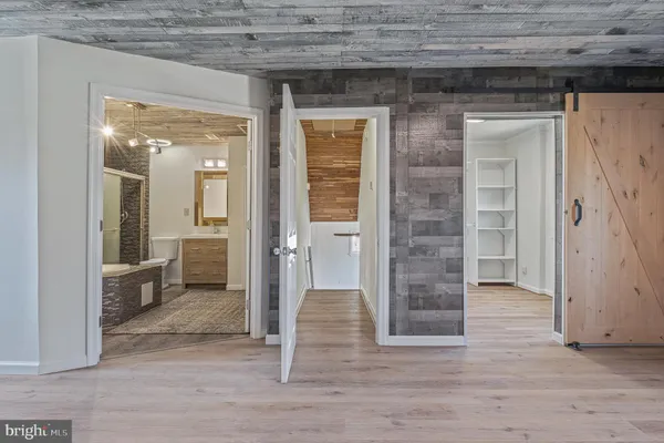 a bathroom with a bathtub and toilet