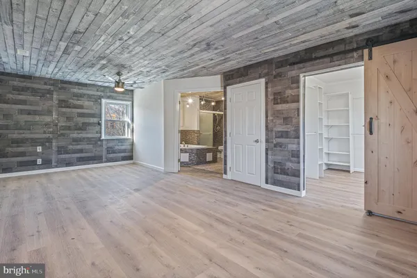 a bathroom with a granite countertop bathtub and sink