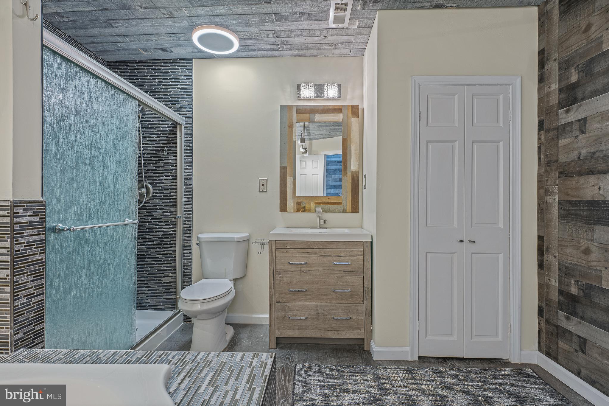 312 North Hammonds Ferry Road Linthicum Heights, MD 21090 - Photo 33 of 56 a bathroom with a toilet and a shower