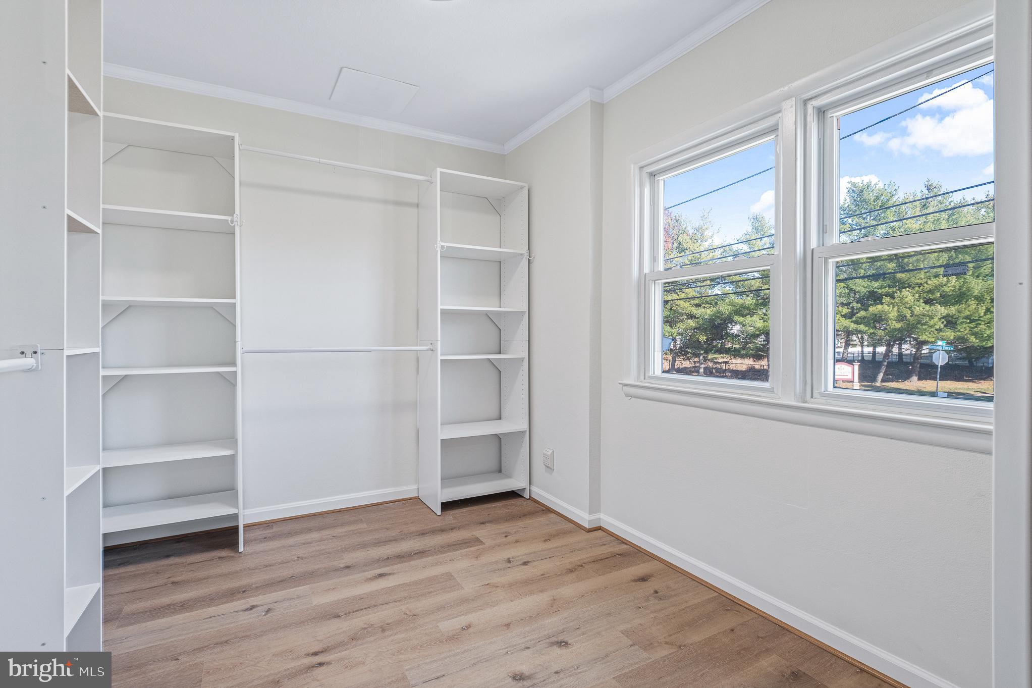 312 North Hammonds Ferry Road Linthicum Heights, MD 21090 - Photo 36 of 56 a view of a room with wooden floor and windows
