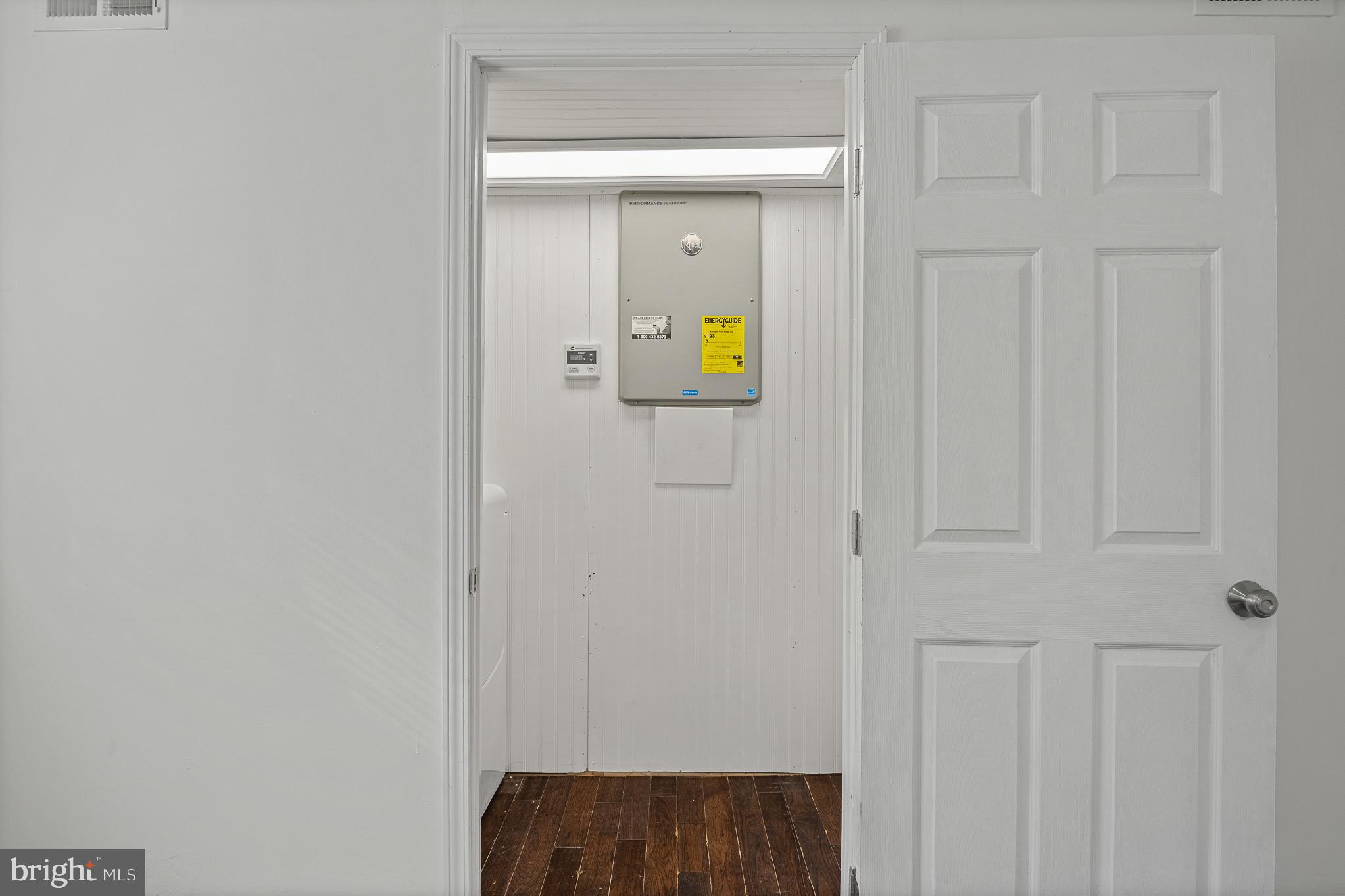 312 North Hammonds Ferry Road Linthicum Heights, MD 21090 - Photo 49 of 56 a view of storage and utility room with wooden floor