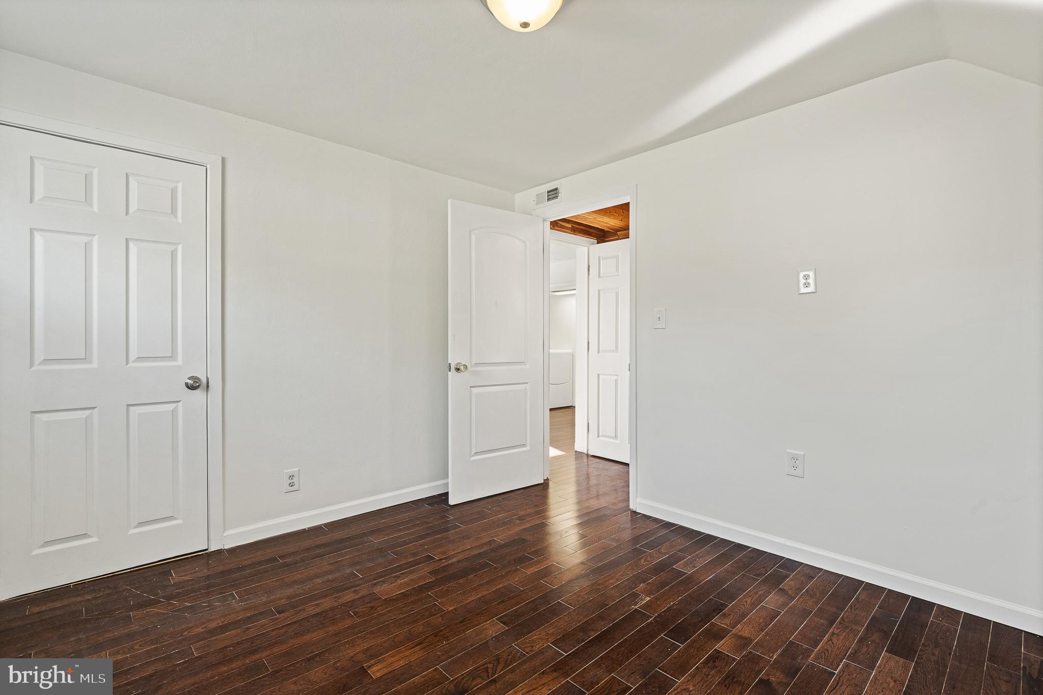 312 North Hammonds Ferry Road Linthicum Heights, MD 21090 - Photo 51 of 56 a view of an empty room with wooden floor
