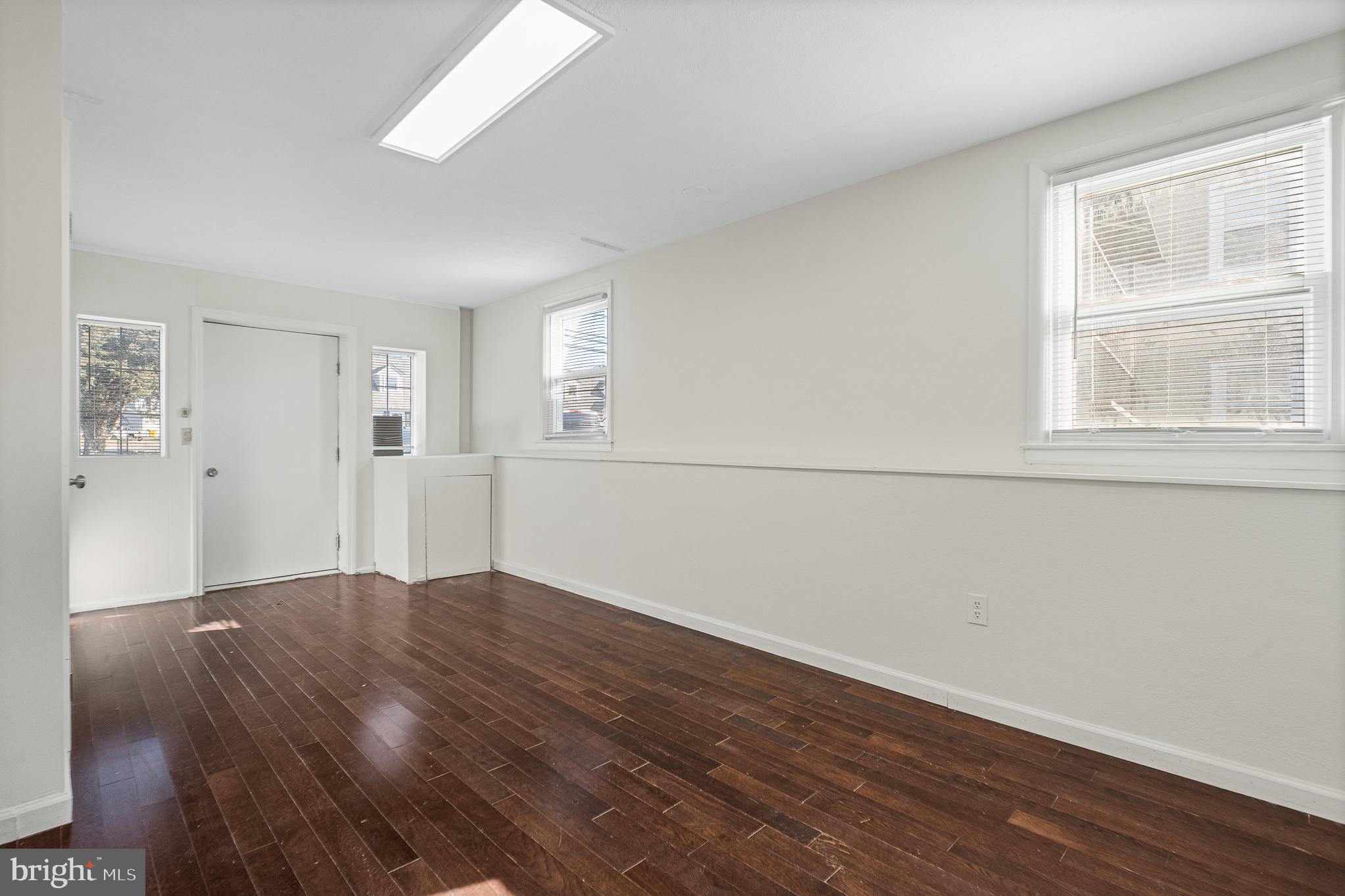 312 North Hammonds Ferry Road Linthicum Heights, MD 21090 - Photo 53 of 56 an empty room with wooden floor and windows