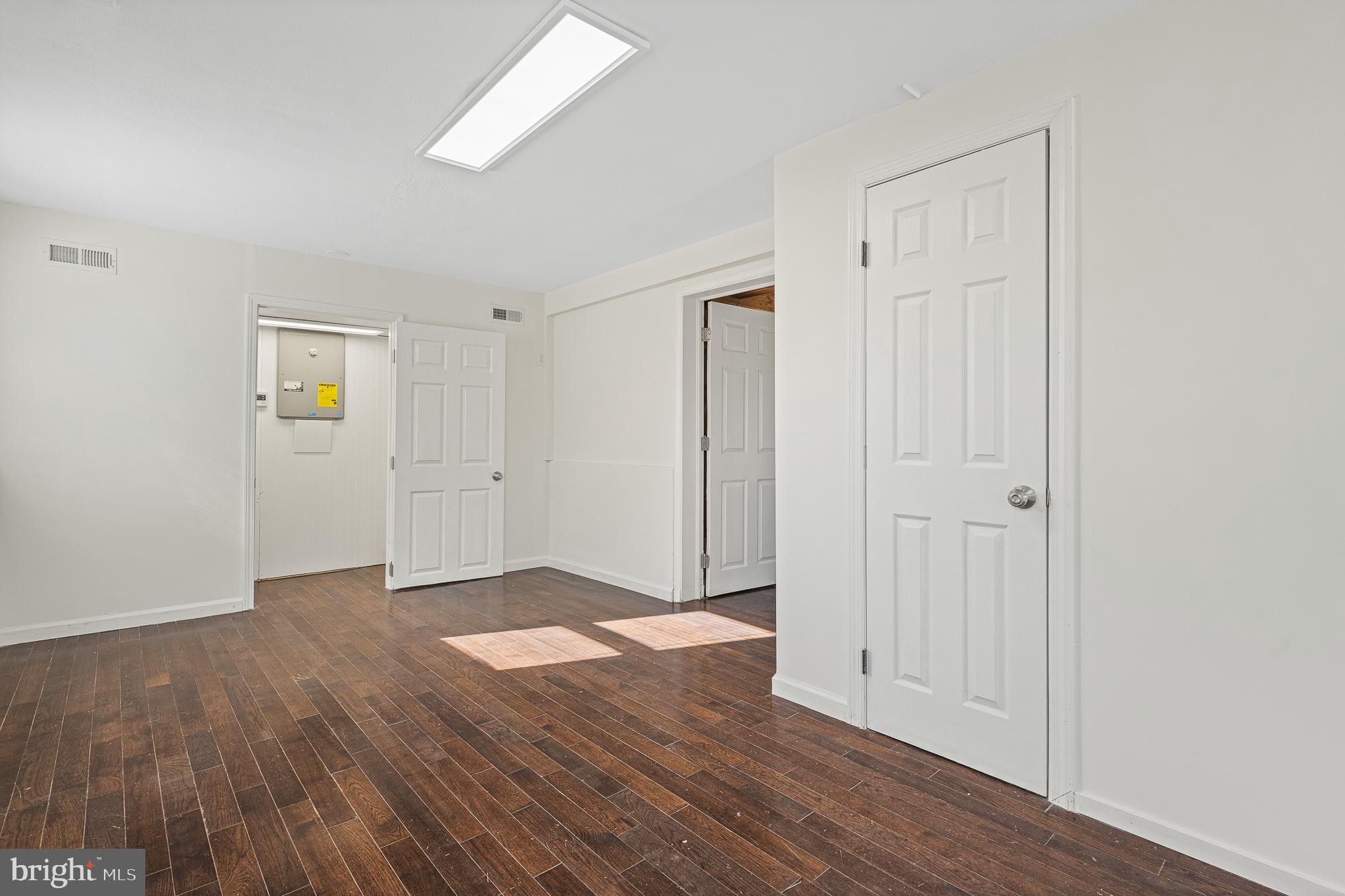 312 North Hammonds Ferry Road Linthicum Heights, MD 21090 - Photo 56 of 56 an empty room with wooden floor