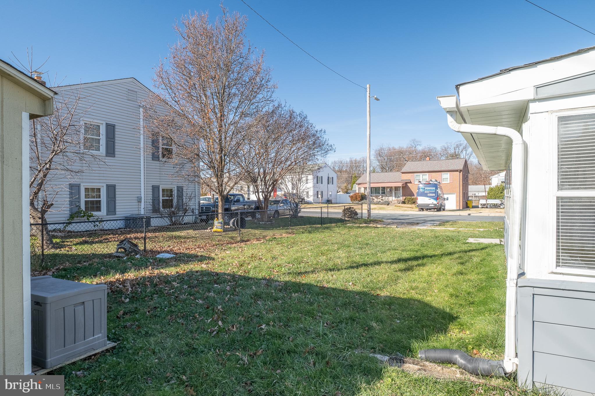 312 North Hammonds Ferry Road Linthicum Heights, MD 21090 - Photo 9 of 56 a view of a house with a big yard and a large tree