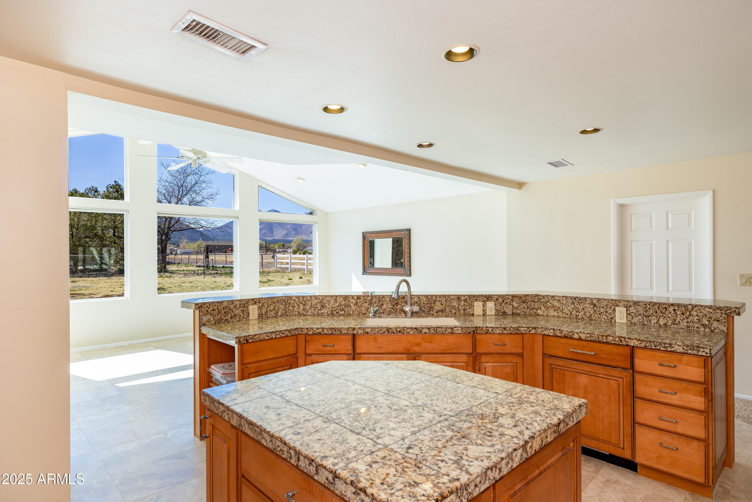 8230 Koch Field Road Flagstaff, AZ 86004 - Photo 16 of 69 a kitchen with granite countertop a counter top space appliances and cabinets