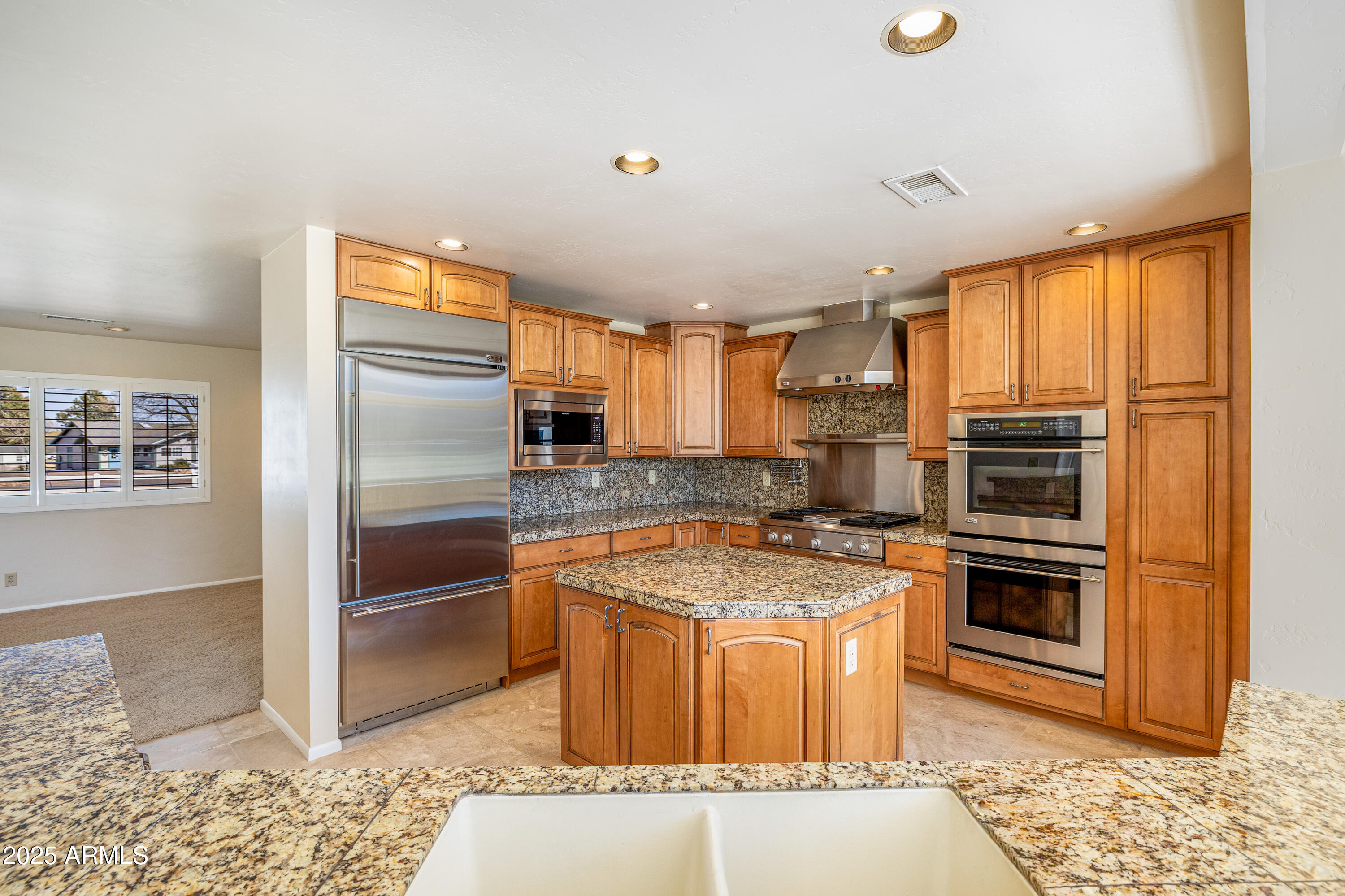 8230 Koch Field Road Flagstaff, AZ 86004 - Photo 18 of 69 a kitchen with stainless steel appliances granite countertop a sink stove and refrigerator