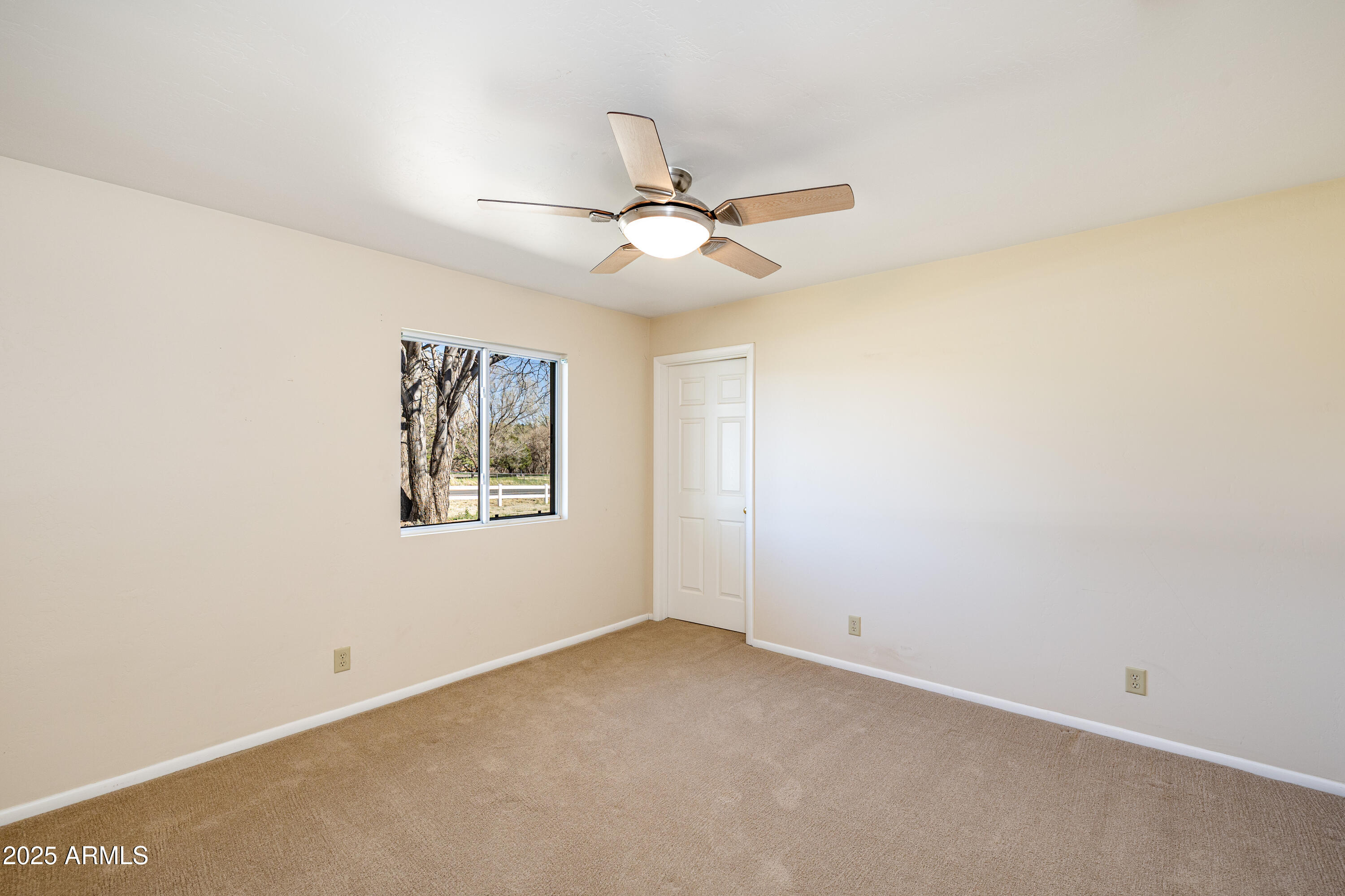 8230 Koch Field Road Flagstaff, AZ 86004 - Photo 29 of 69 a view of an empty room with a window