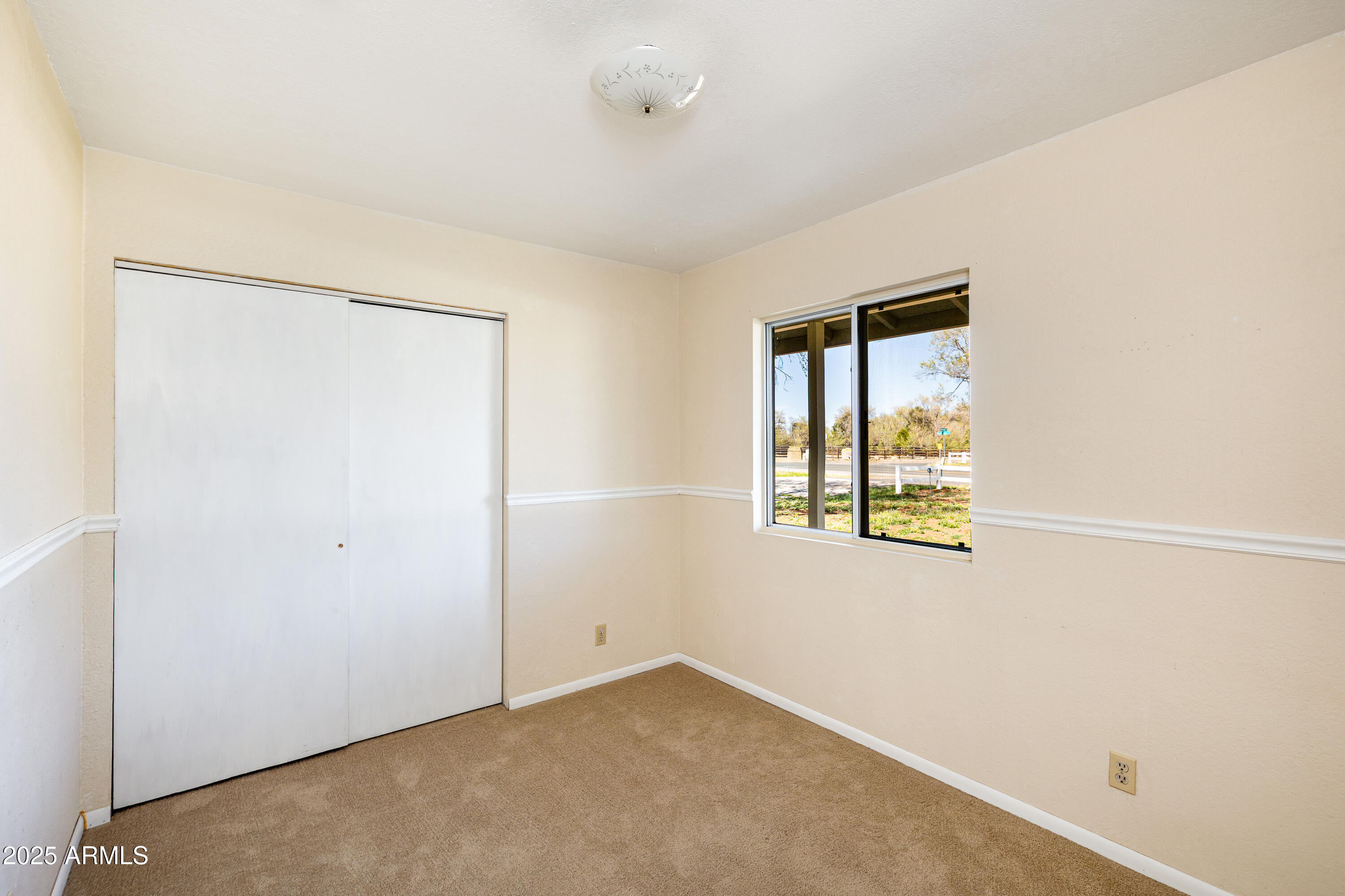 8230 Koch Field Road Flagstaff, AZ 86004 - Photo 30 of 69 an empty room with windows and closet