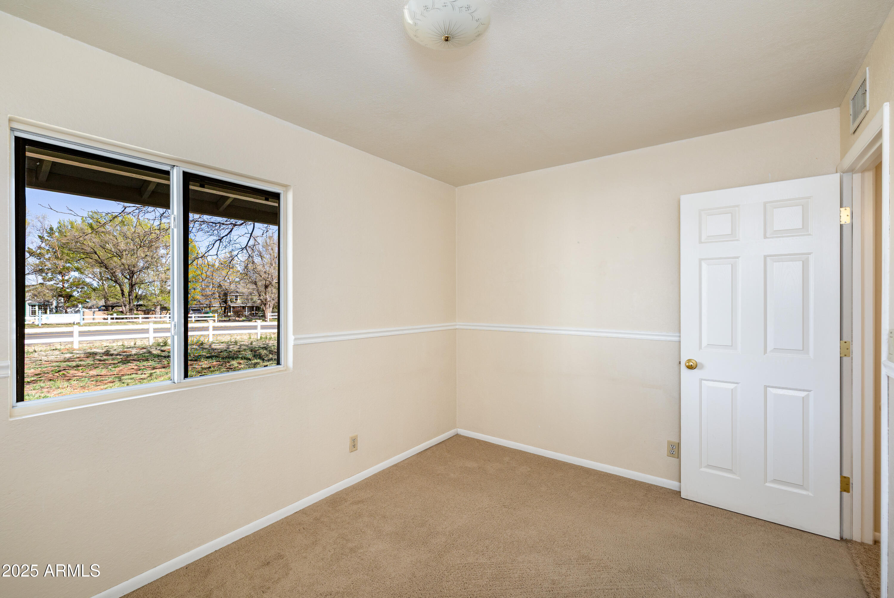 8230 Koch Field Road Flagstaff, AZ 86004 - Photo 31 of 69 an empty room with a window