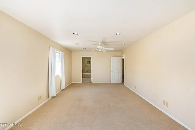 a view of a terrace with a table and chairs