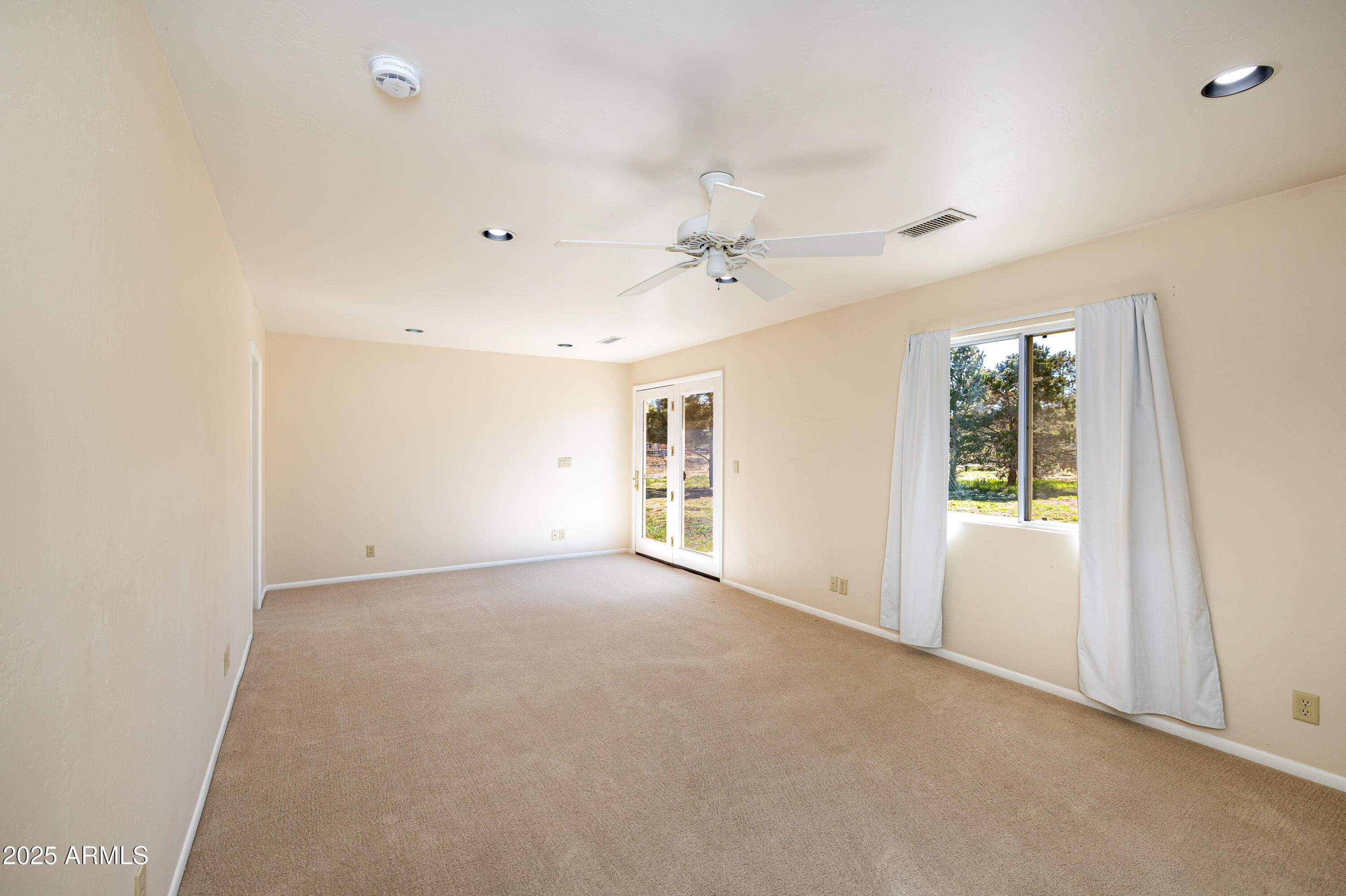 8230 Koch Field Road Flagstaff, AZ 86004 - Photo 35 of 69 a view of an empty room with a window